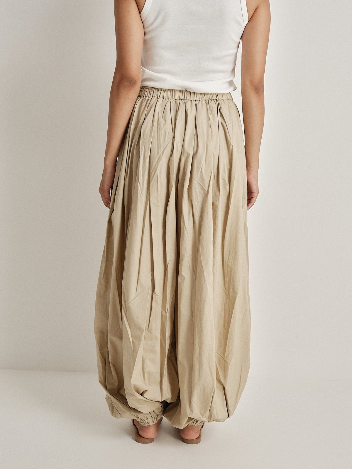 Pantalone plissé a gamba ampia